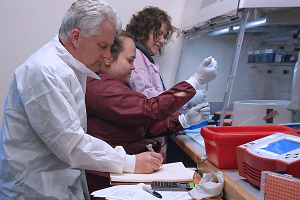 Pictured above, from left to right: UVM Cancer Center and Vermont Integrated Genomics Resource laboratory technicians Scott Tighe, Pheobe Laaguiby, and Jessica Hoffman run tests for a potential alternative to the prescribed COVID-19 test.
