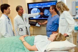 Health professionals reviewing a patient scan image