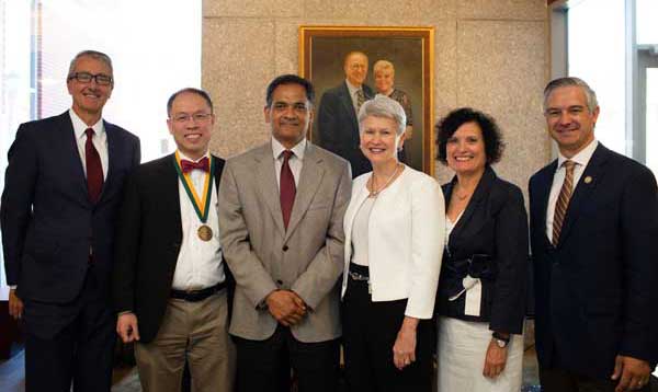 Fung posing with group at Green & Gold Professor Inauguration Fung posing with group at Green & Gold Professor Inauguration
