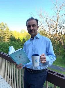 Dr. Khan reading the first year book