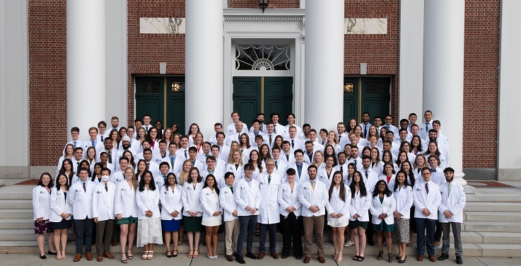 Class of 2027 in their white coats