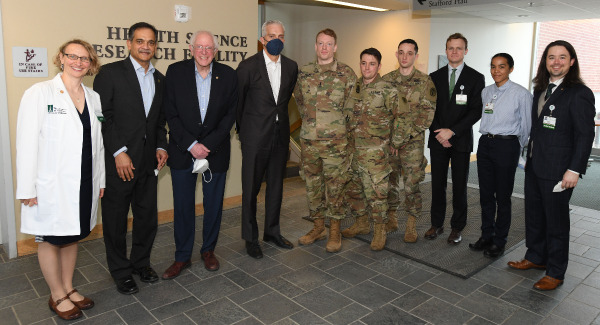 Sanders and McDonough pose with UVM and UVM Larner Med Representatives