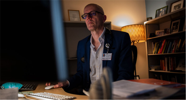 Tim Lahey Dr. Lahey working in his office