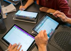 Students using Surface computers